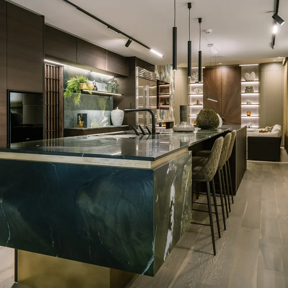 Open-plan luxury showroom space with layered lighting and custom interiors