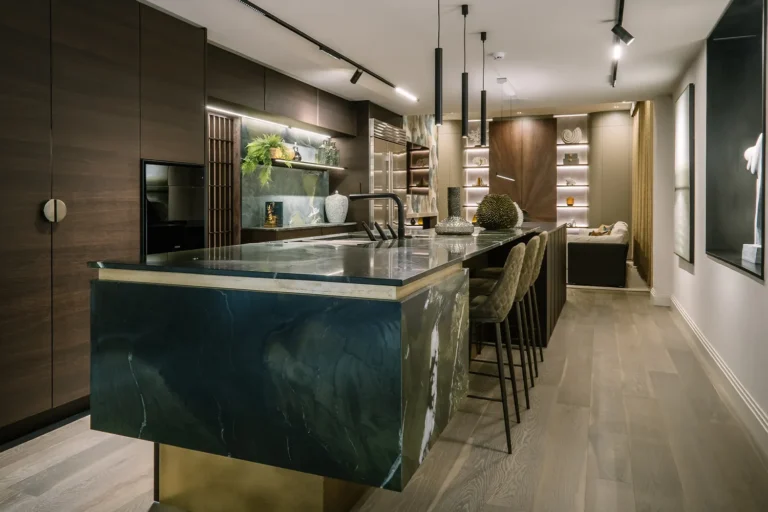 Open-plan luxury showroom space with layered lighting and custom interiors