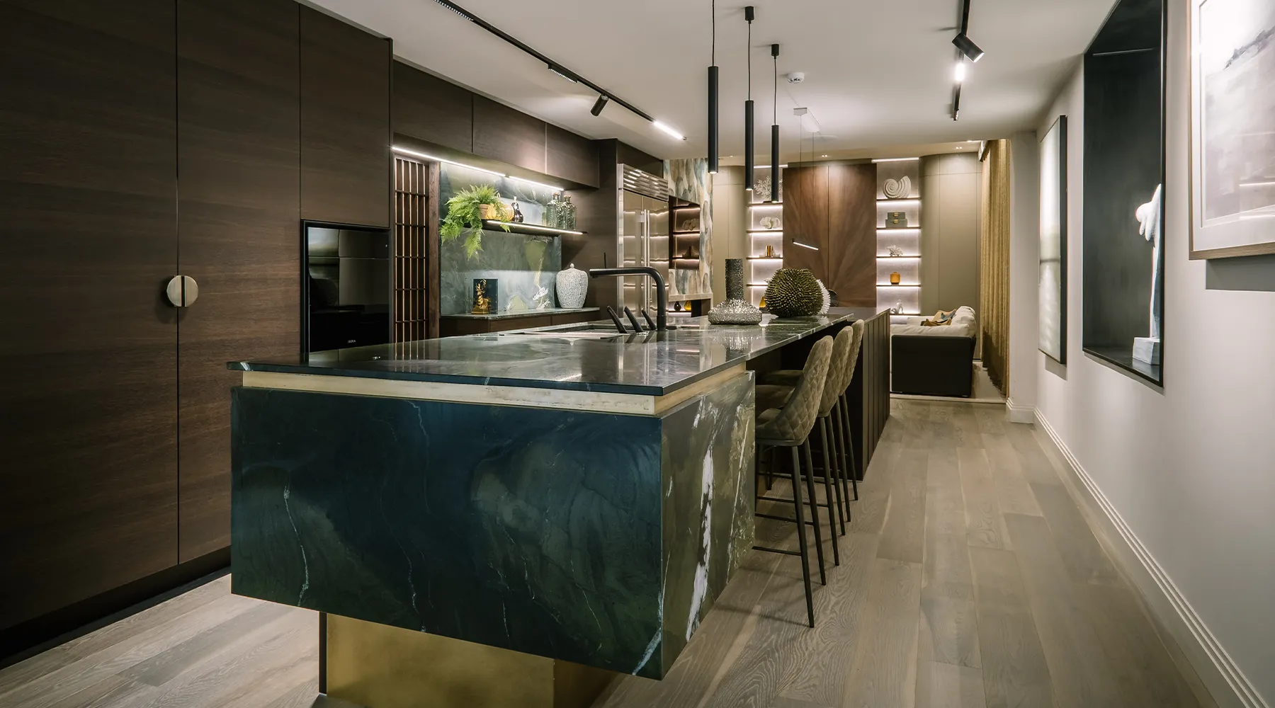 Open-plan luxury showroom space with layered lighting and custom interiors