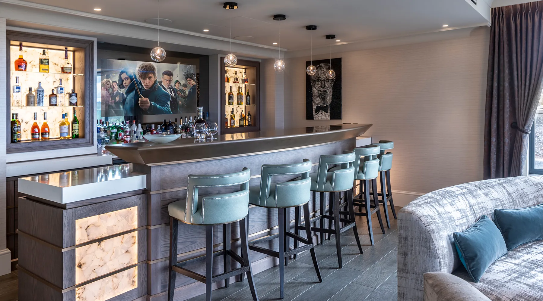 Bespoke bar and seating with integrated TV, audio and lighting design by Majik House