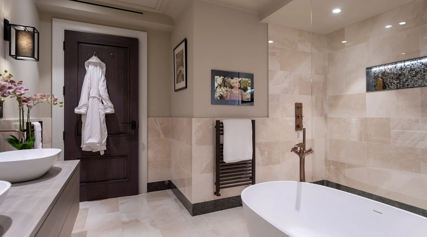 Luxurious bathroom with lighting design and control, built-in TV screen and audio by Majik House